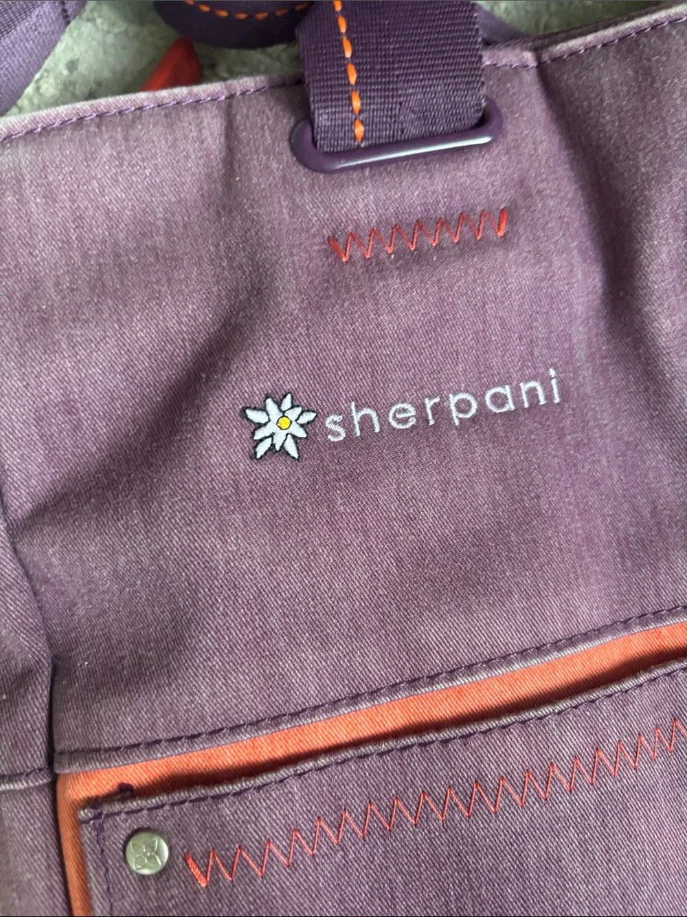 Sherpani purple messenger bag with red trim